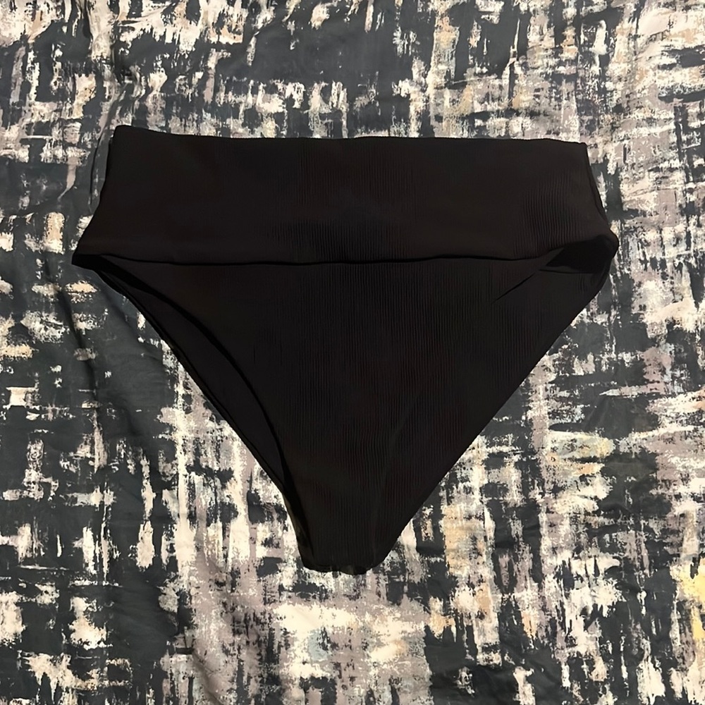 A black high waisted bikini bottom.ale your butt look good 😉
